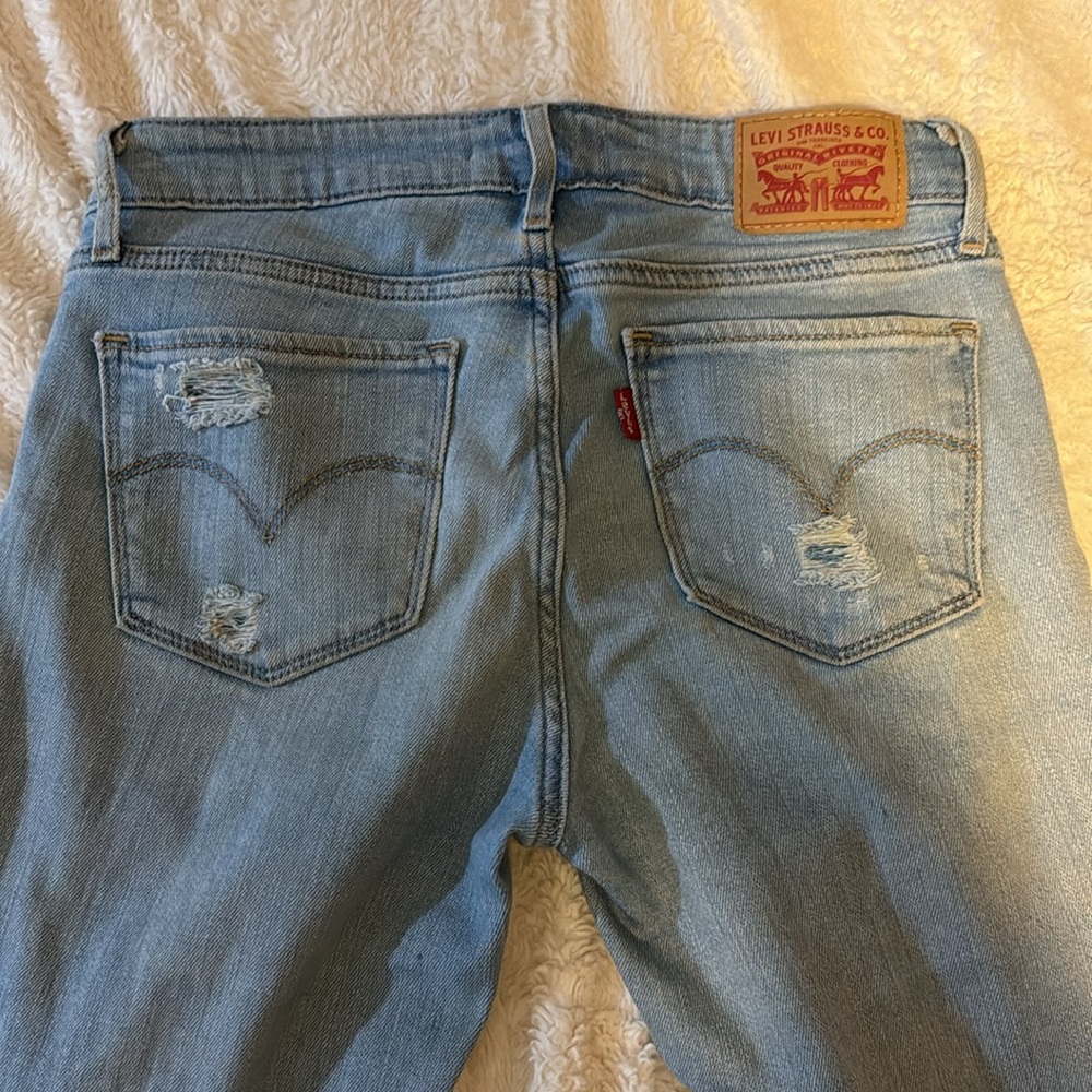 Skinny light washed ripped jeans size 25